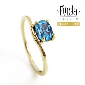 Szellő sárga arany gyűrű kék topázzal